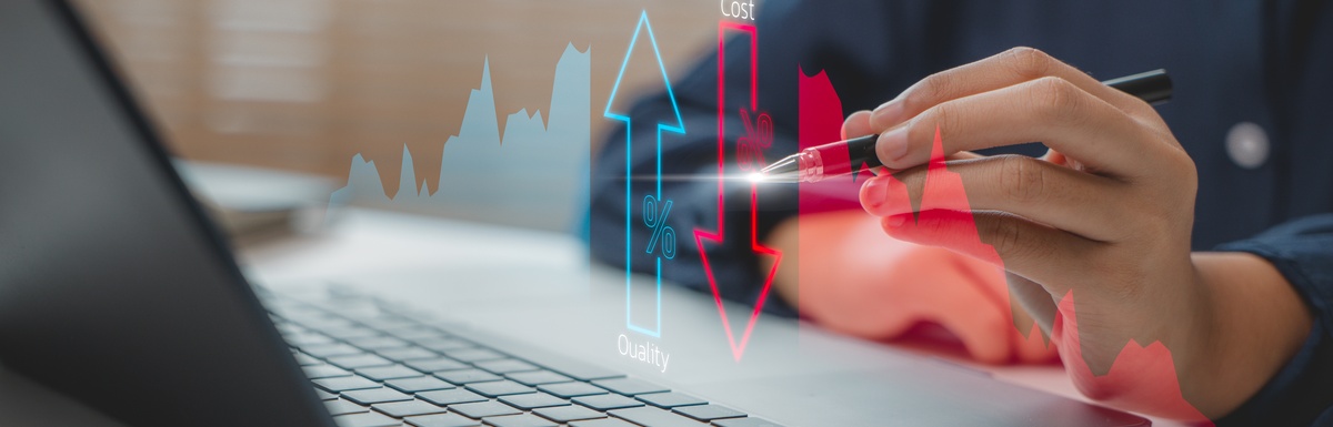 A person sits at a laptop and uses a stylus to interact with a graphic showing costs going down and quality going up.